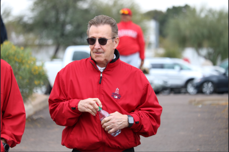 Arte Moreno with a water bottle