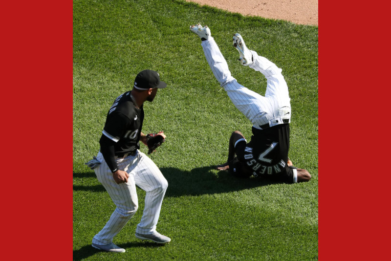 Tim Anderson in a White Sox uniform taking a header on the infield grass
