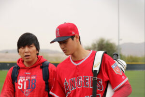 Ippei Mizuhara looking baffled with Shohei Ohtani standing to his left