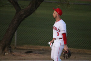 Zach Neto in home white uniform facing to viewer left at spring training 2024