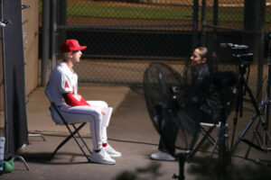 Zach Neto in a chair in home whites on team photo day 2024