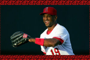 Curtis Pride smiling in an Angels red on white uniform